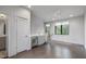 Spacious bonus room featuring hardwood floors, natural light, and a wet bar area at 133 City View Ne Ct, Atlanta, GA 30308