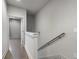 Upper hallway with hardwood floors that leads to another room at 133 City View Ne Ct, Atlanta, GA 30308