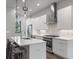 Contemporary kitchen with stainless steel appliances, white cabinets, and an island with bar seating at 133 City View Ne Ct, Atlanta, GA 30308