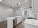 Bright kitchen with white countertops, stainless steel appliances, and modern pendant lighting at 133 City View Ne Ct, Atlanta, GA 30308