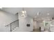 Open concept living space with hardwood floors, modern lighting, and staircase access at 133 City View Ne Ct, Atlanta, GA 30308