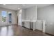 Entertainer's room with French doors to deck and beverage center with stainless steel fridge at 133 City View Ne Ct, Atlanta, GA 30308