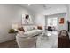 Cozy living room featuring stylish furniture, modern artwork, and a bright dining area at 133 City View Ne Ct, Atlanta, GA 30308