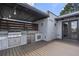Deck featuring an outdoor kitchen with a grill, granite countertop, and stainless steel fridge at 133 City View Ne Ct, Atlanta, GA 30308