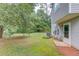 Grassy area with fence on side and view of house at 1900 Tribble Ridge Dr, Lawrenceville, GA 30045