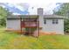Back of house featuring wooden deck and stairs to backyard at 1900 Tribble Ridge Dr, Lawrenceville, GA 30045