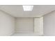 Spacious finished basement with carpet, neutral paint and access to storage at 1900 Tribble Ridge Dr, Lawrenceville, GA 30045