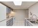 Basement kitchen with gray cabinets, light counters, and a white stove at 1900 Tribble Ridge Dr, Lawrenceville, GA 30045
