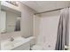 Neutral bathroom with white vanity, toilet, and shower/tub combination featuring a shower curtain at 1900 Tribble Ridge Dr, Lawrenceville, GA 30045