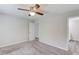 Spacious bedroom features a ceiling fan, neutral paint, and plush carpeting at 1900 Tribble Ridge Dr, Lawrenceville, GA 30045