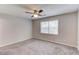 Bedroom featuring neutral walls, carpet, and a window with blinds at 1900 Tribble Ridge Dr, Lawrenceville, GA 30045