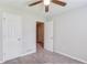 Bright bedroom features a ceiling fan, plush gray carpet, and neutral paint at 1900 Tribble Ridge Dr, Lawrenceville, GA 30045