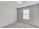 Bright bedroom with plush carpet, neutral walls and window with blinds at 1900 Tribble Ridge Dr, Lawrenceville, GA 30045
