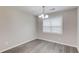 Dining room featuring wood-look floors, neutral walls, and a window with blinds at 1900 Tribble Ridge Dr, Lawrenceville, GA 30045