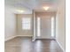 Bright entryway with wood-look flooring, a white front door, and a window allowing for natural light at 1900 Tribble Ridge Dr, Lawrenceville, GA 30045