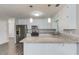 Updated kitchen with stainless steel appliances, white cabinets, and a granite countertop island at 1900 Tribble Ridge Dr, Lawrenceville, GA 30045