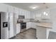 Updated kitchen featuring stainless steel appliances, white cabinets, and granite countertops at 1900 Tribble Ridge Dr, Lawrenceville, GA 30045