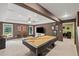 Finished basement with a billiards table, neutral carpeting, and plenty of space for entertaining at 3675 Ridgeway Ter, Suwanee, GA 30024