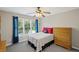 Bedroom offering bright natural light, a ceiling fan, and neutral wall paint at 3675 Ridgeway Ter, Suwanee, GA 30024