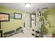 Home gym with workout equipment, soft carpeting, and access to other rooms in the house at 3675 Ridgeway Ter, Suwanee, GA 30024