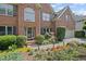 Charming brick home features a landscaped garden, a two-car garage, and a welcoming front entrance at 3675 Ridgeway Ter, Suwanee, GA 30024