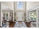 Elegant foyer with hardwood floors, high ceilings, and a large window above the front door at 3675 Ridgeway Ter, Suwanee, GA 30024