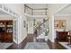 Grand two-story foyer featuring hardwood floors, staircase, and open access to other rooms at 3675 Ridgeway Ter, Suwanee, GA 30024