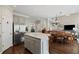 Open kitchen with gray cabinets, an island, stainless steel appliances, and breakfast nook at 3675 Ridgeway Ter, Suwanee, GA 30024