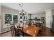 Eat-in kitchen offers a breakfast area, modern appliances, granite countertops, and backyard views at 3675 Ridgeway Ter, Suwanee, GA 30024
