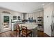 Gourmet kitchen with granite countertops, stainless steel appliances, and a center island at 3675 Ridgeway Ter, Suwanee, GA 30024