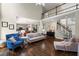 Open-concept living room with hardwood floors, high ceilings, and a staircase to the second floor at 3675 Ridgeway Ter, Suwanee, GA 30024
