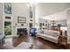 Open-concept living room features a fireplace, hardwood floors, and access to the kitchen and dining area at 3675 Ridgeway Ter, Suwanee, GA 30024