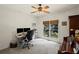 Office space featuring natural light, a ceiling fan, and a built-in bookcase at 3675 Ridgeway Ter, Suwanee, GA 30024