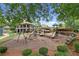 Community playground featuring multiple slides, swings, and climbing structures at 3675 Ridgeway Ter, Suwanee, GA 30024