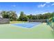 Well-maintained community tennis court surrounded by lush greenery, perfect for recreation at 3675 Ridgeway Ter, Suwanee, GA 30024