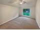 Spacious bedroom with neutral carpet and natural light from window at 46 Timber Walk Dr, Sharpsburg, GA 30277
