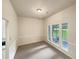 Dining room area with lots of natural light and neutral decor at 46 Timber Walk Dr, Sharpsburg, GA 30277