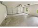 Spacious two-car garage with white doors and natural light at 46 Timber Walk Dr, Sharpsburg, GA 30277