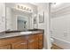 Inviting bathroom featuring a shower-tub combo and a stylish vanity with ample counter space at 1362 Brockett Pl, Clarkston, GA 30021