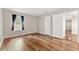 Bright bedroom with sleek hardwood flooring, neutral wall color, and an inviting atmosphere at 1362 Brockett Pl, Clarkston, GA 30021