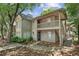 Inviting two-story home with a charming exterior, balcony, and well-maintained landscaping at 1362 Brockett Pl, Clarkston, GA 30021