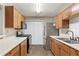 Well-equipped kitchen with stainless steel appliances and ample cabinet space for storage at 1362 Brockett Pl, Clarkston, GA 30021