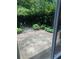 Private back patio area with lush green landscaping, great for relaxing or entertaining in a peaceful setting at 1810 Ashborough Se Rd # G, Marietta, GA 30067