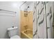 Bathroom featuring a yellow tub and shower with tiled walls, a toilet, and towel bar at 1810 Ashborough Se Rd # G, Marietta, GA 30067