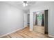 Bedroom featuring stylish wood floors, ceiling fan, closet, and a window at 1810 Ashborough Se Rd # G, Marietta, GA 30067