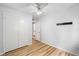Bedroom featuring stylish wood floors, a closet, and a door to an ensuite bathroom at 1810 Ashborough Se Rd # G, Marietta, GA 30067