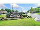 Ashborough Village Condominiums sign with stone base and manicured lawn welcomes residents and guests at 1810 Ashborough Se Rd # G, Marietta, GA 30067