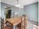 Cozy dining room with hardwood floors and neutral paint, adjacent to the kitchen at 1810 Ashborough Se Rd # G, Marietta, GA 30067