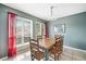 Dining room with natural light featuring a wooden table and decorative lighting fixture at 1810 Ashborough Se Rd # G, Marietta, GA 30067