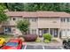 Well-maintained townhouse exterior with beautiful landscaping, convenient parking, and inviting entrance at 1810 Ashborough Se Rd # G, Marietta, GA 30067